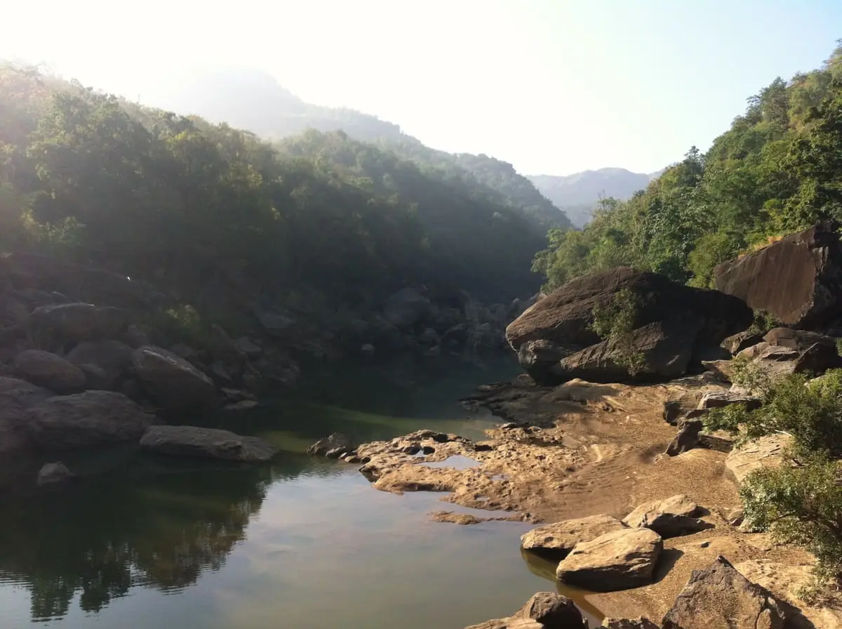 Still water among rocks and wooded hills inside Satpura National Park (photo: Nilabh, December 2015)