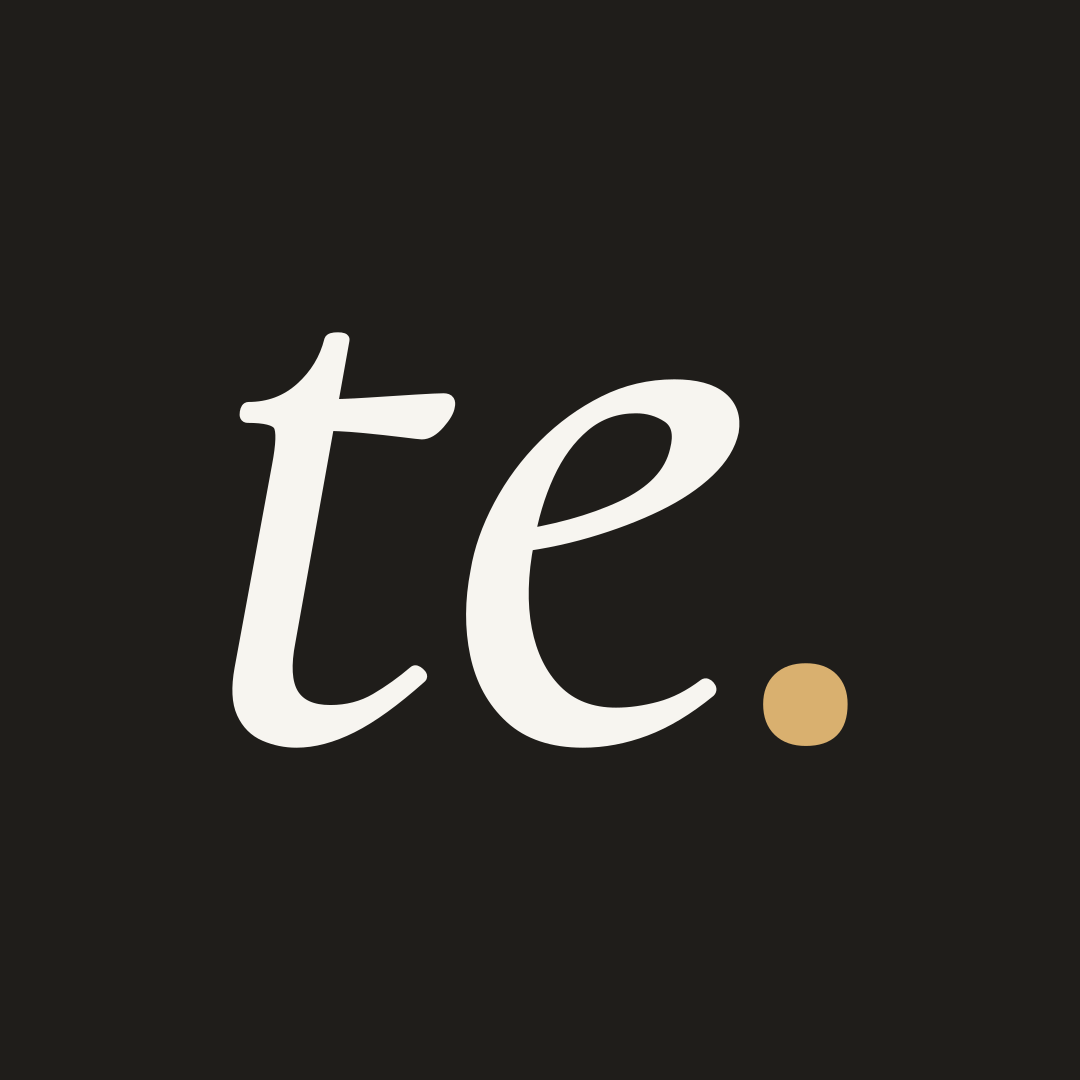 The te. monogram: ink square, white letters, an ochre full stop